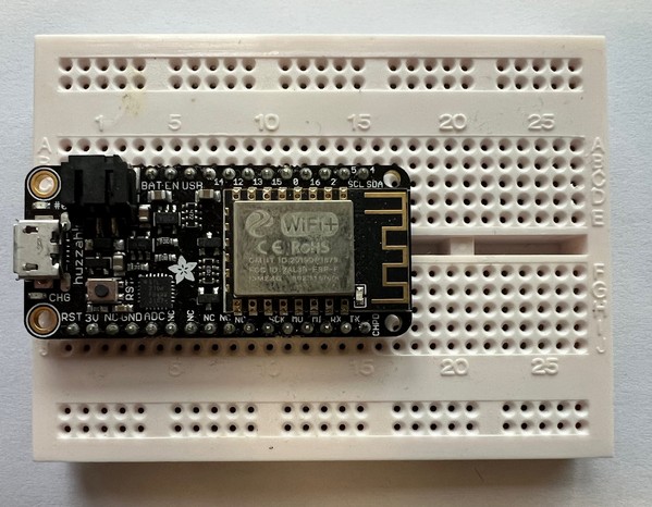 Adafruit Feather HUZZAH mounted on a breadboard
