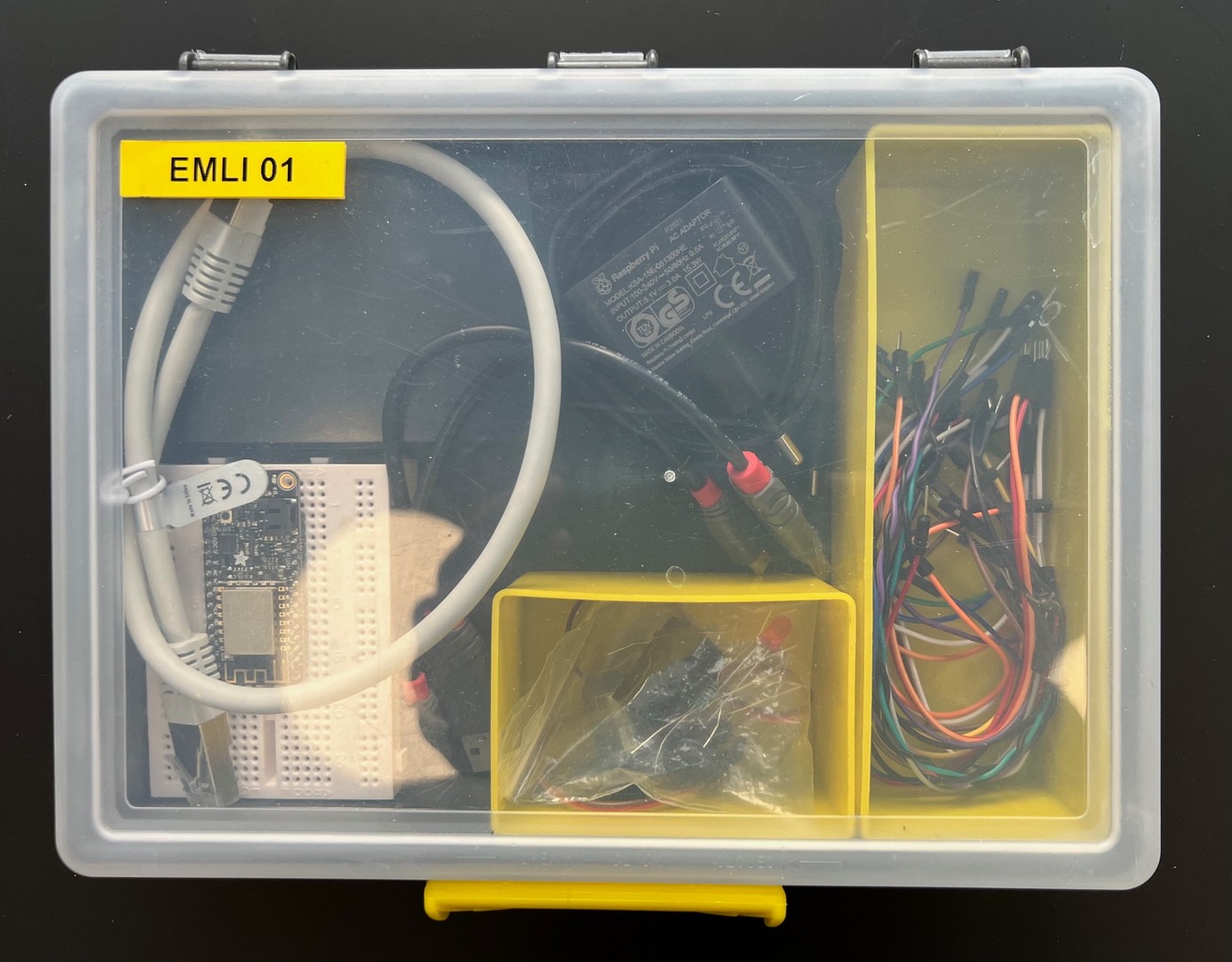 Open EMLI course kit containing boards, cables, and electronic components
